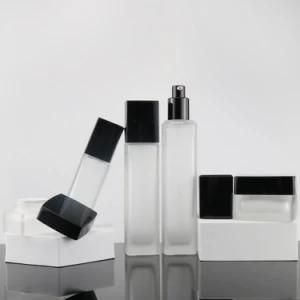 Luxury 40ml 110ml 120ml Empty Square Black Cosmetic Face Lotion Cream Glass Bottle Jar Package Set with Spray Pump