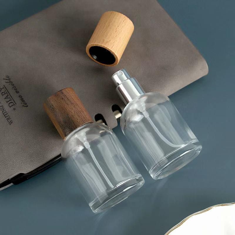 Custom Logo 30ml/50ml Luxury Cylinder Glass Thick Bottom Spray Empty Perfume Bottle with Wooden Cap Travel Cosmetic Container