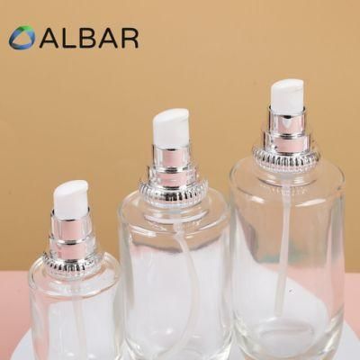 Silver Circle Customized Pump Glass Bottles in Round Cylinder Clear with Printing Logo
