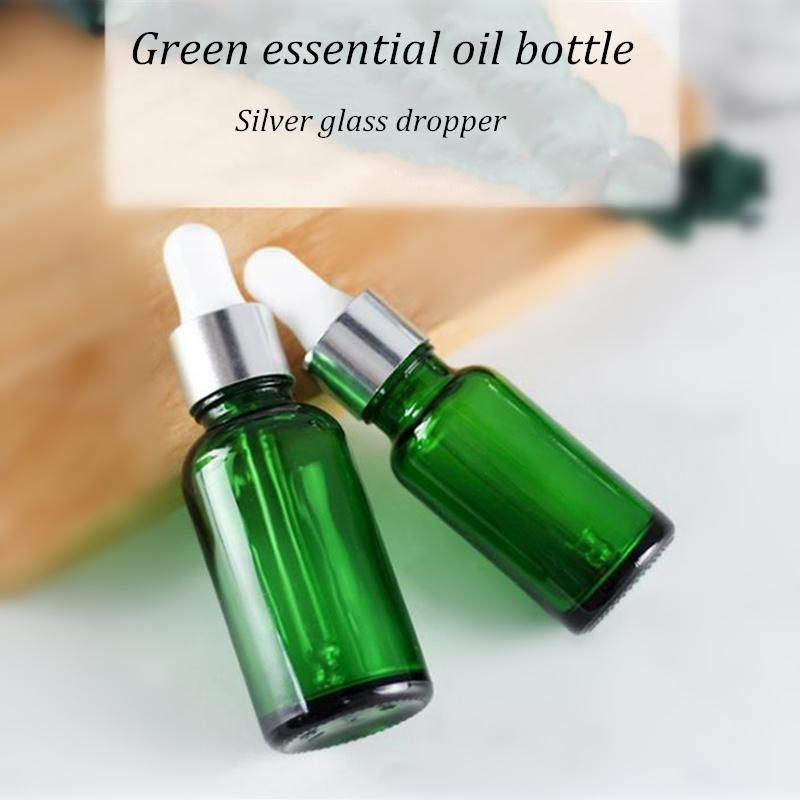 Green Glass Cosmetic Packaging Essential Oil Bottle with Glass Dropper or Plug for Cosmetic Oil