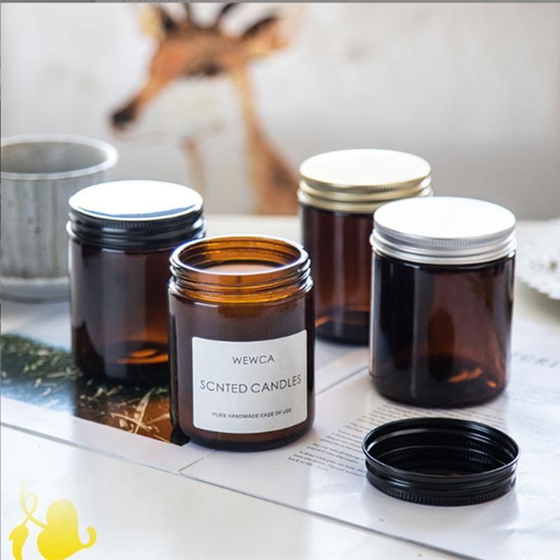 a Glass Can for Holding Candles. a Brown Glass Candlestick with a Lid