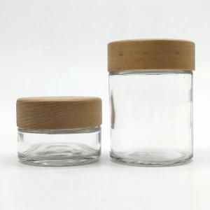 Hot Sell 1oz 2oz 3oz 4oz Straight Side Glass Food Storage Jar W/ Wooden Bamboo Child Resistant Lid Cap