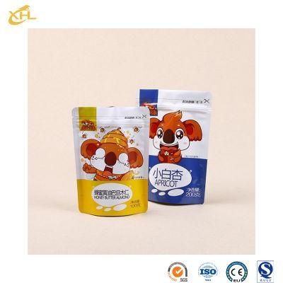 Xiaohuli Package China Stand up Pouch with Nozzle Manufacturing Plastic Plastic Pouch for Snack Packaging