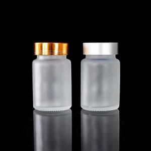 Empty Frosted Clear 60ml 100ml Wide Mouth Clear Amber Clear Glass Pharmaceutical Pill Bottle Jar with Gold Metal Lid