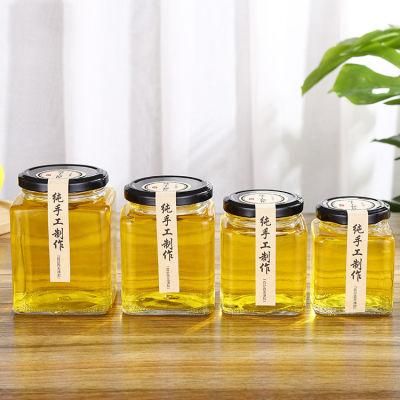 Wholesale Customized High Quality 770ml Hexagonal Honey Jam Glass Jar Gourmet Hex Jars with Screw Tin Cap for Food, Candy, Honey