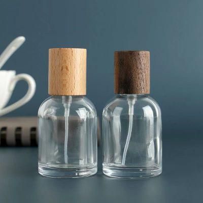 100ml 50ml 30ml Thick Clear Glass Essential Oil Bottle with Wood Lid for Perfume Aromatherapy Portable Square Refillable Bottle Custom Design