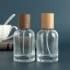 Custom Logo Wooden Lids Cylinder Glass Crimp Bottle Perfume Bottles 30 Ml Glass Spray Cosmetic Bottle with Wooden Cap