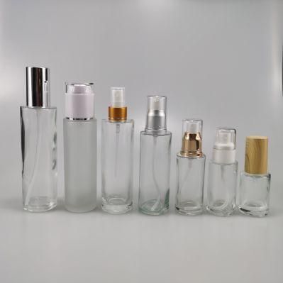30ml 40ml 50ml 80ml 100ml 120ml Transparent Frosted Cylinder Glass Serum Lotion Bottle with Gold Silver Treatment Pump