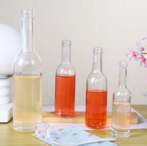 Customize 100ml Small Capacities Flint Round Metal Lids Glass Bottles for Liquor Manufacturer