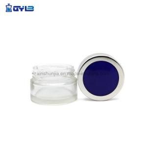 Empty Clear Glass Bottle with Blue-Silver Lid