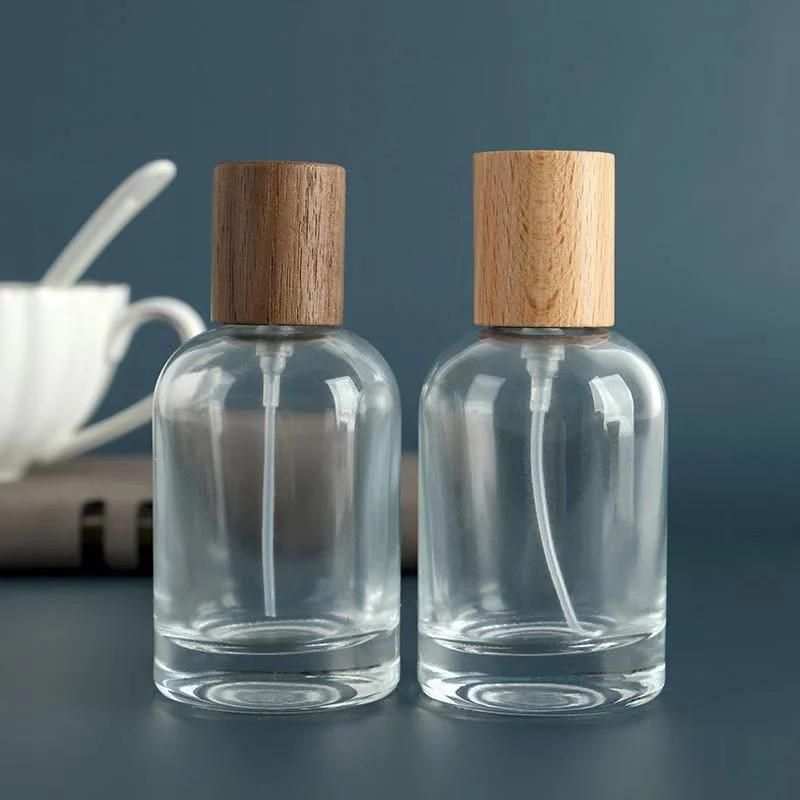 Custom Logo Wooden Lids Cylinder Glass Crimp Bottle Perfume Bottles 30 Ml Glass Spray Cosmetic Bottle with Wooden Cap