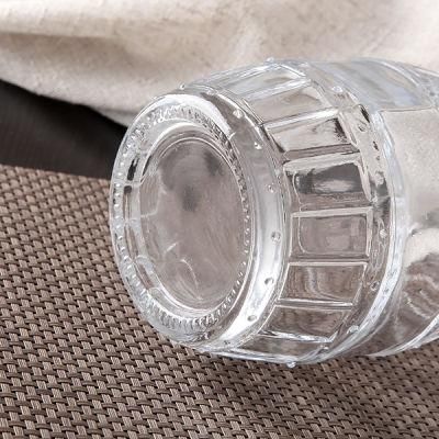 Wholesale Clear Embossed Glass Bottle with Golden Cap