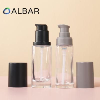 Cylinder Flat Shoulder Bottle Glass in Black or Clear Frosted with Press Pump