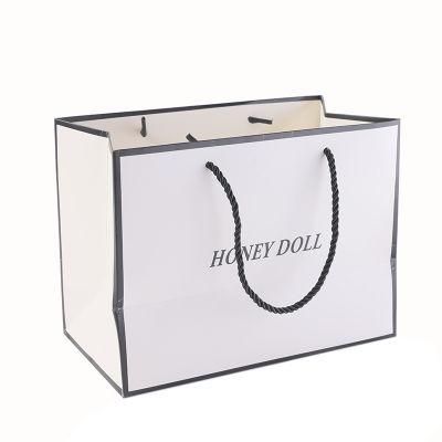 Hot Sale Luxury White Foil Logo Printing Shopping Paper Bag with Black Grosgrain Ribbon