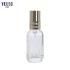 30ml China Supplier Luxury Cosmetic Packaging Round Glass Bottle with Golden Effect Pump Head