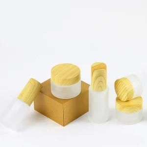 Factory Price Frosted Cosmetic Packaging Glass Jar Cream Bottle with Wooden Grain Lid