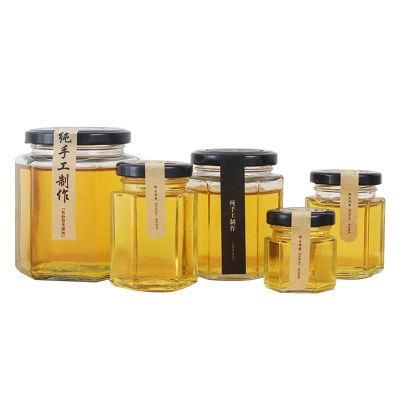 Hot Selling Whole 1000g 730ml 35oz Glass Bee Shaped Honey Jar Glass Hexagonal Jar for Honey Package with Metal Lids