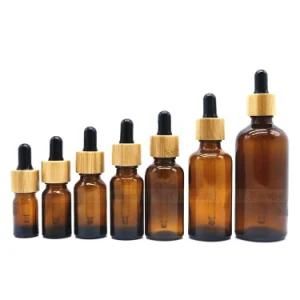 Wholesale Bamboo Cap 5ml 10ml 15ml 20ml 30ml 50ml 100ml Green Blue Clear Amber Glass Dropper Bottle with Bamboo Wooden Lid